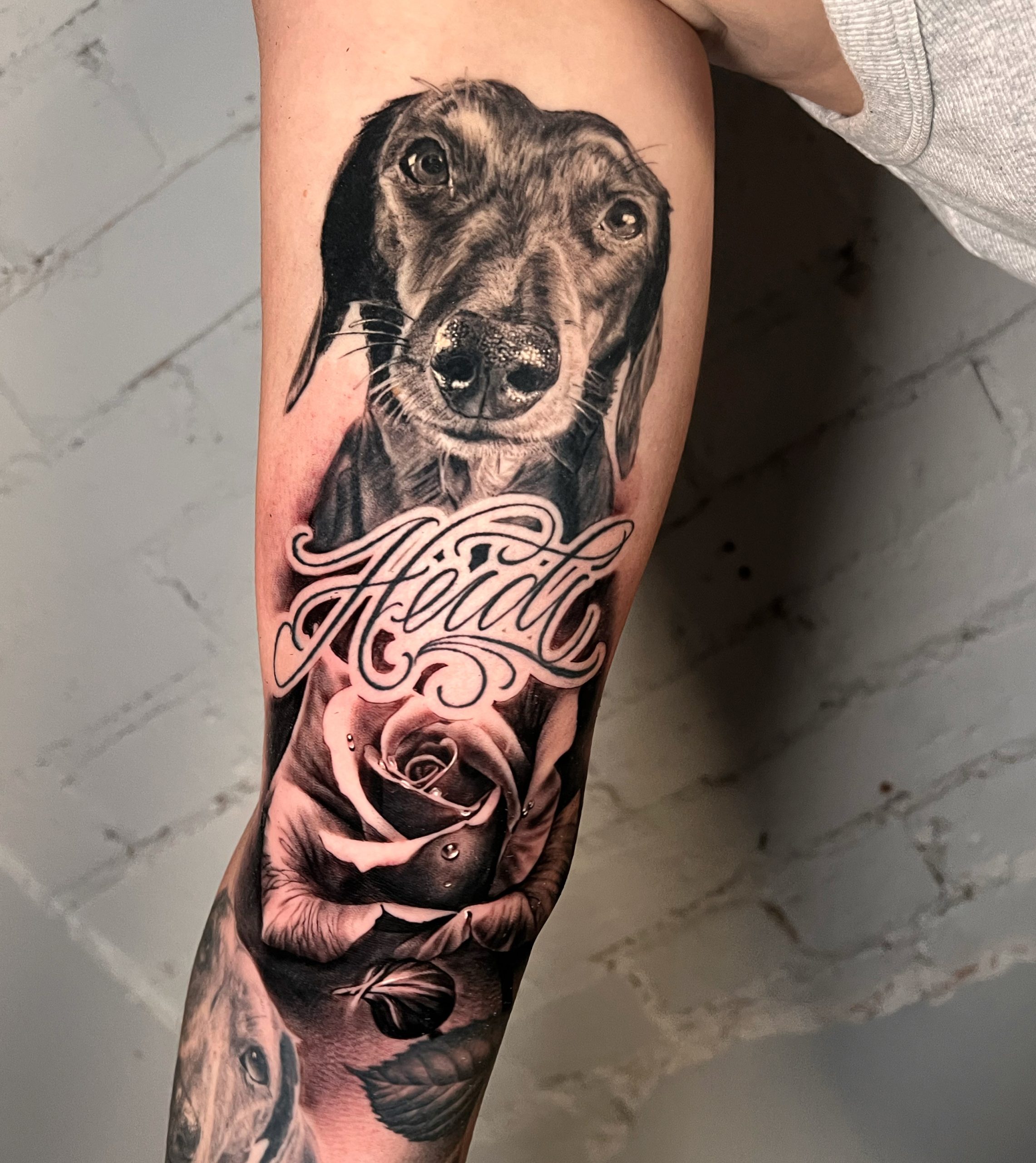 Image of a wrist with a fresh tattoo of three little stars in fineline style